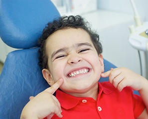 Little boy smiles while visiting his emergency pediatric dentist in Coppell 