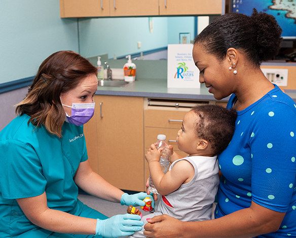 Dentist examining baby's teeth