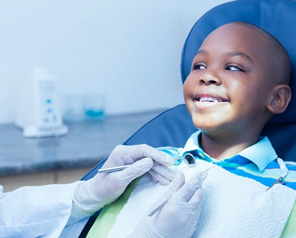 Boy smiling at dentist in Coppell during nitrous oxide dental sedation visit