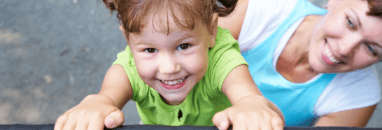 Little girl laughing after restorative dentistry treatment