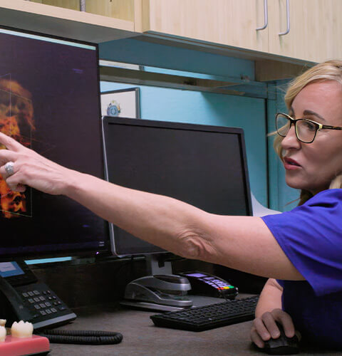 Dental team member capturing digital dental x-rays