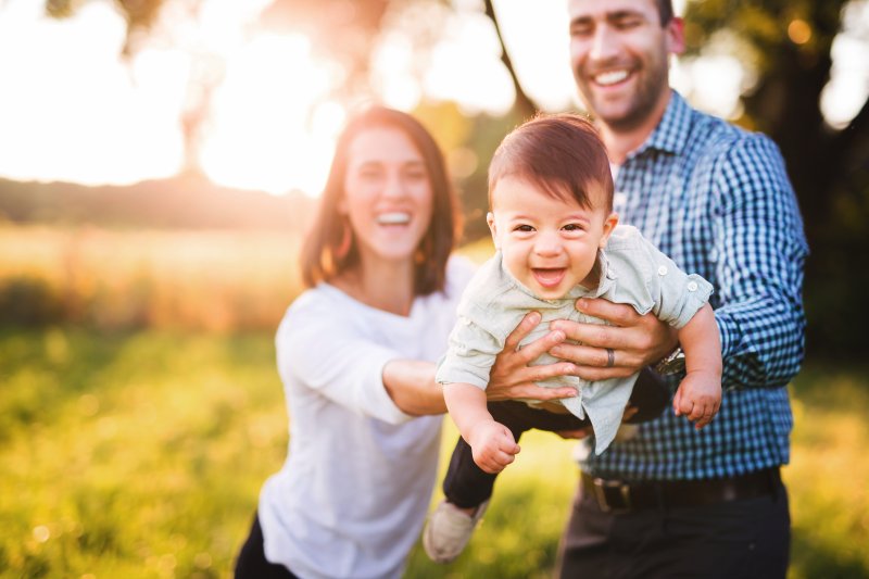 parents holding their baby boy