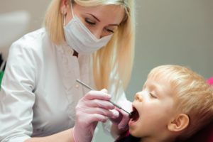 young boy visiting pediatric dentist